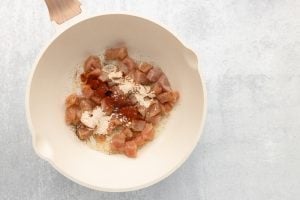 chicken and seasoning added to pan