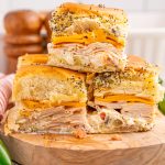 Jalapeno Popper Chicken Sliders stacked on a platter
