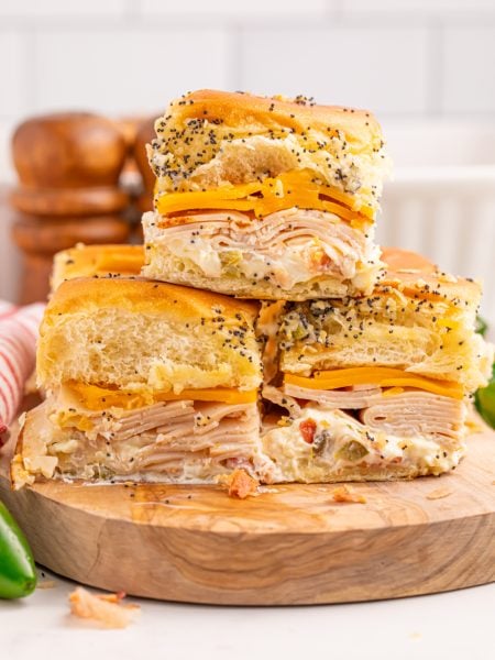 Jalapeno Popper Chicken Sliders stacked on a platter