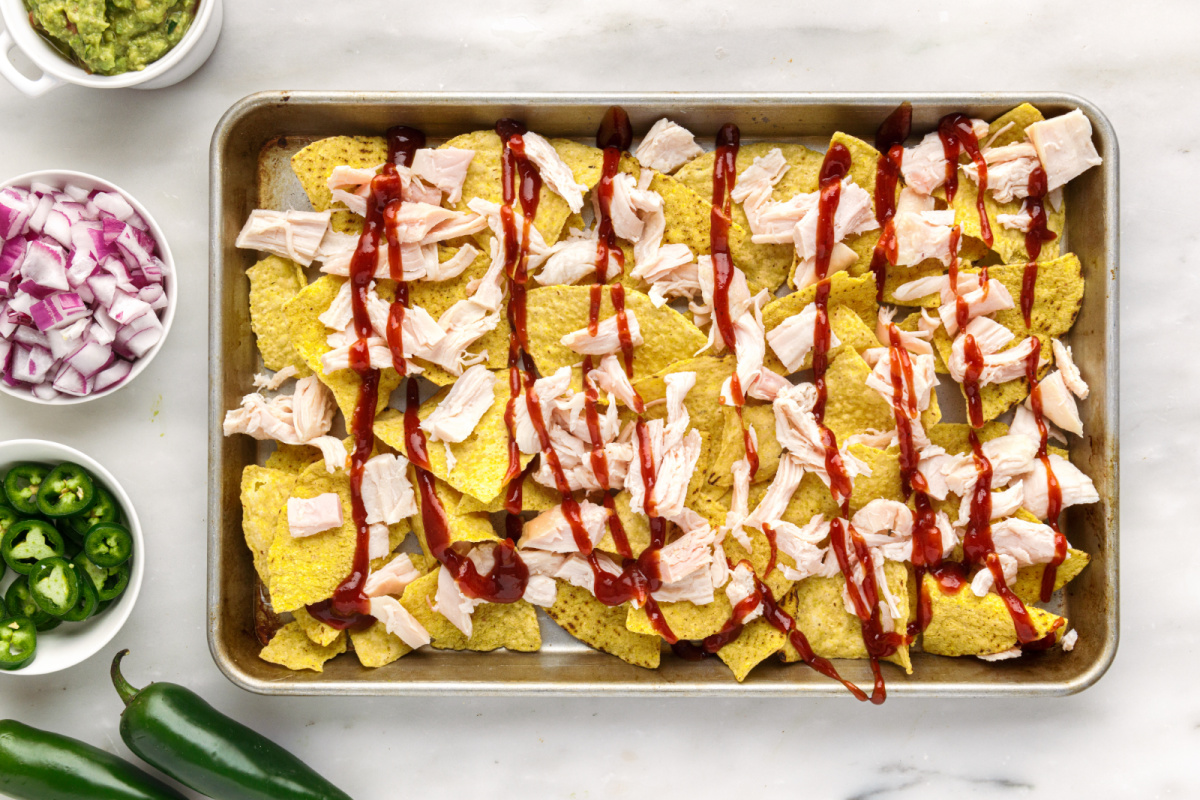 chips topped with chicken drizzled with bbq sauce