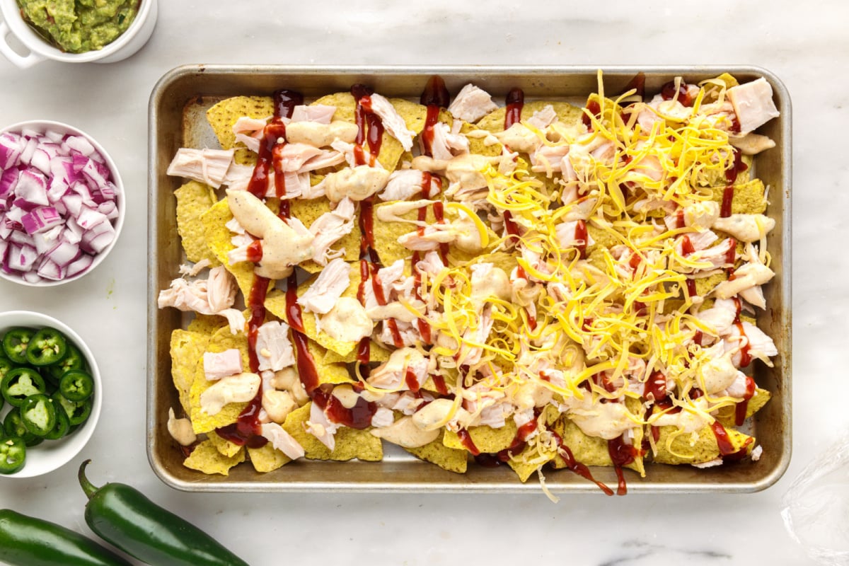 shredded cheese added to nachos