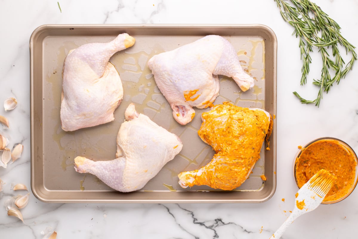 sauce applied to one of the chicken quarters