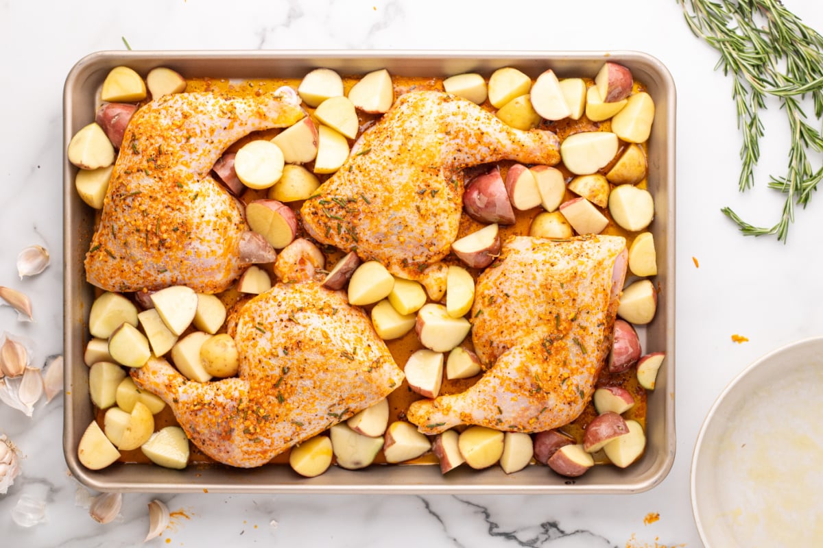 potatoes added to baking sheet