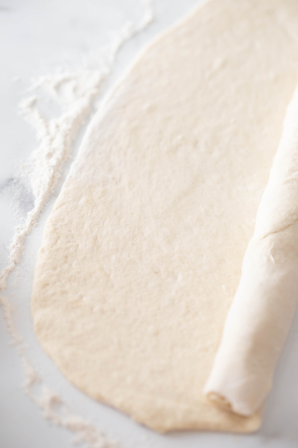 dough being rolled up