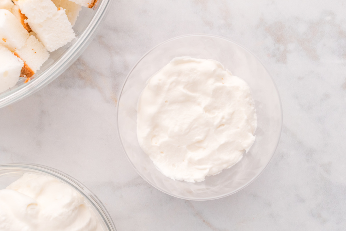 whipped cream added to cups