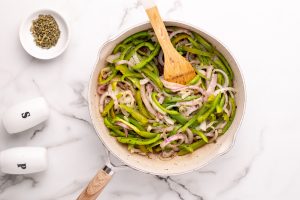 stirring Copycat Chipotle Fajita Veggie in a pan