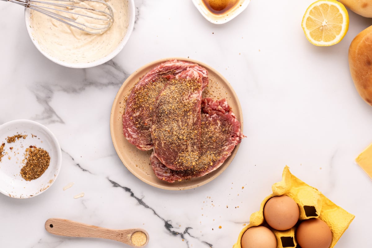steaks with seasoning on it