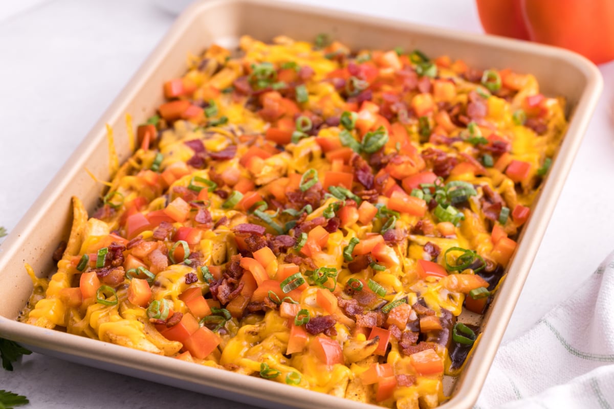 cooked dirty french fries on a baking sheet