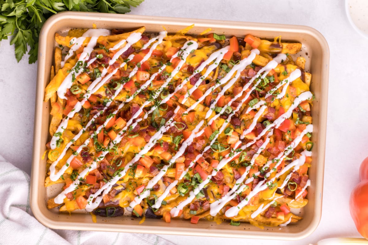ranch drizzled on top of fries