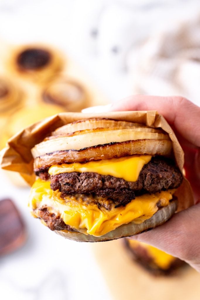 hand holding Flying Dutchman Burgers