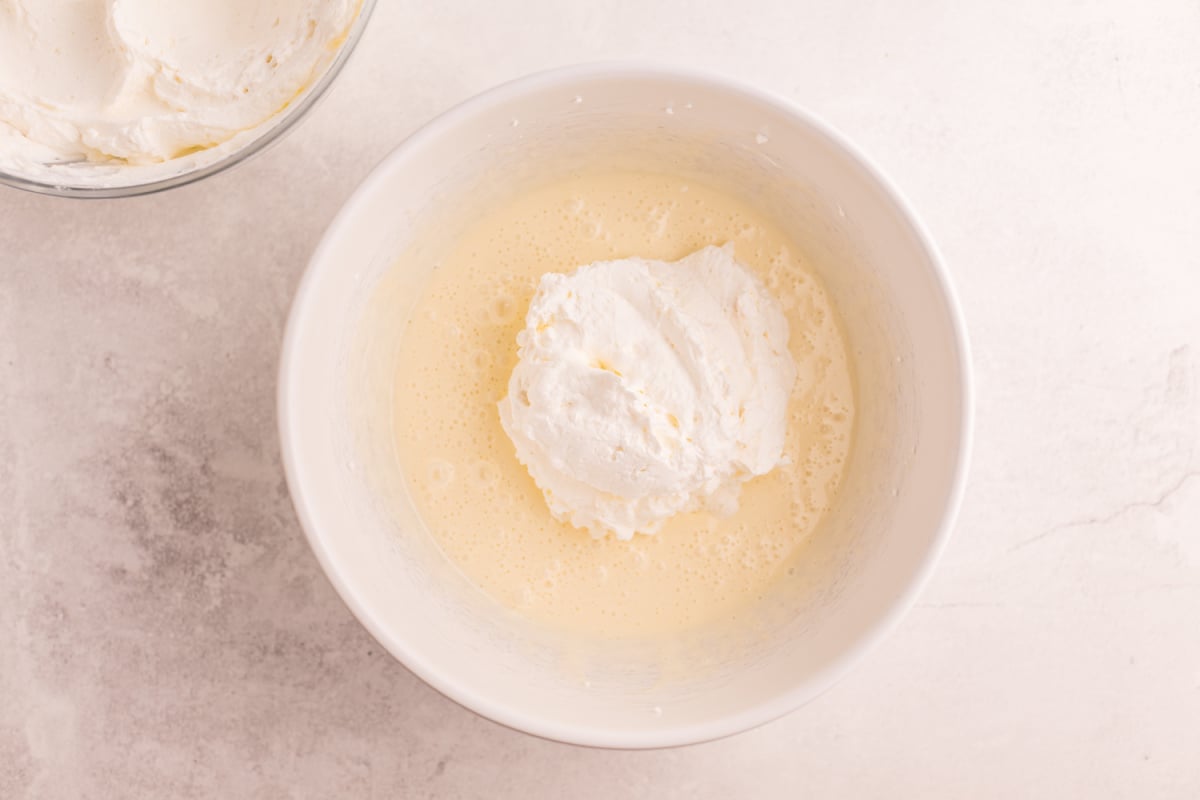 whipped topping being added to condensed milk
