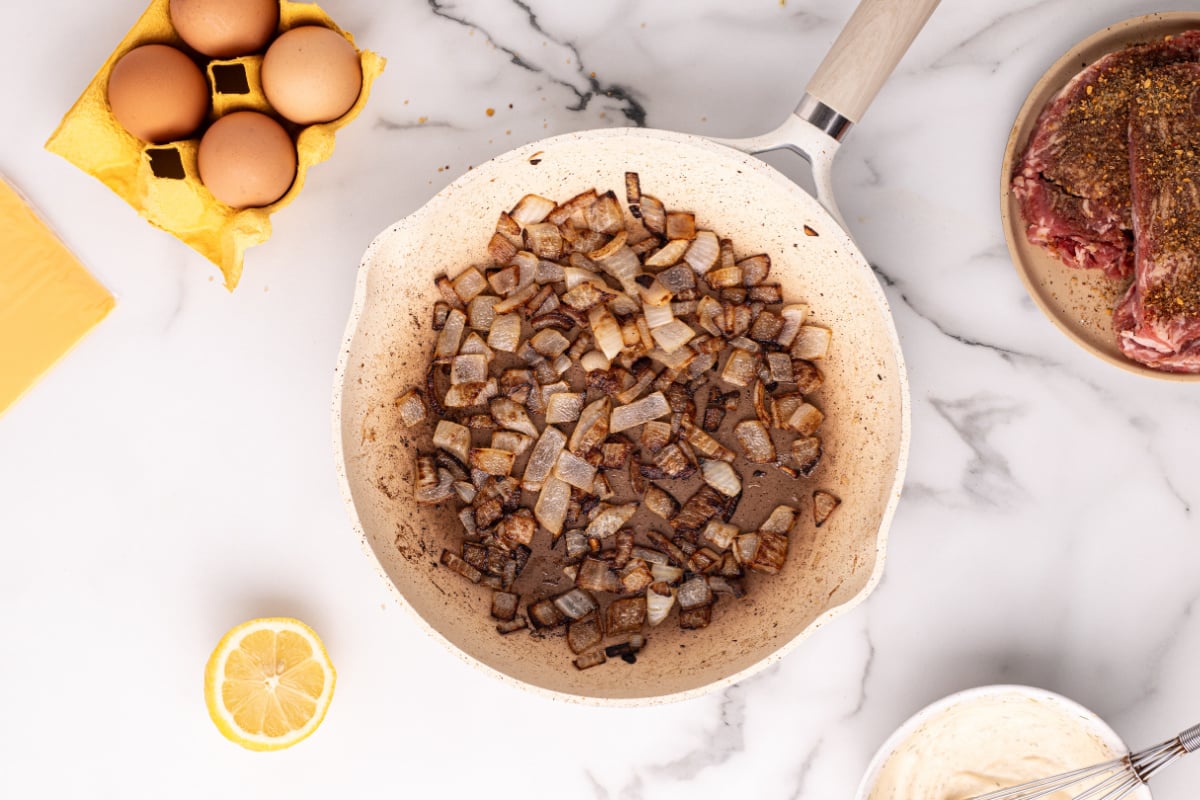 onions cooking in a pan