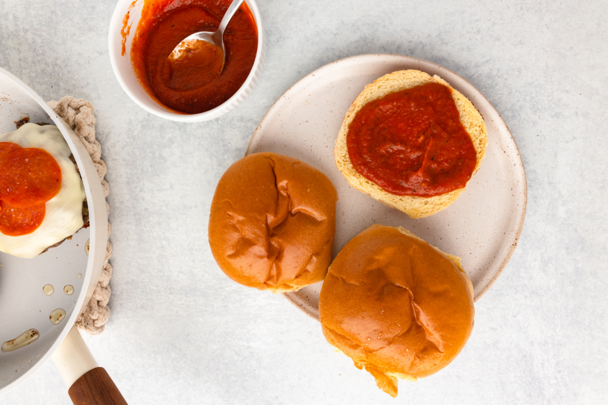 pizza sauce added to bun