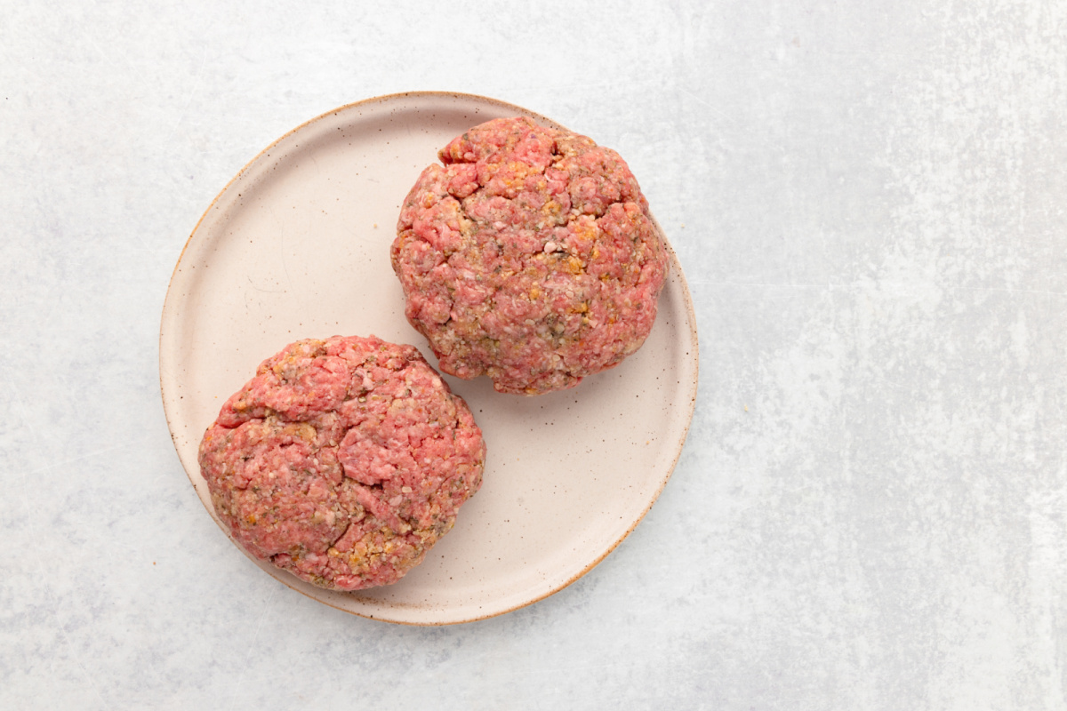 2 hamburger patties on a plate