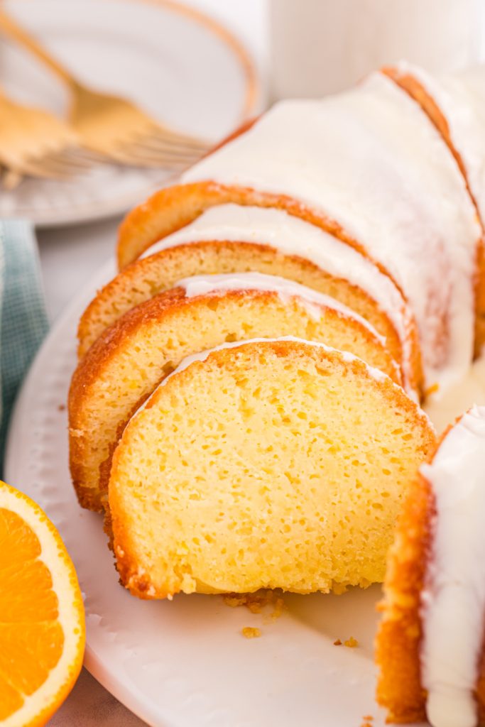 Orange Juice Cake sliced on a plater
