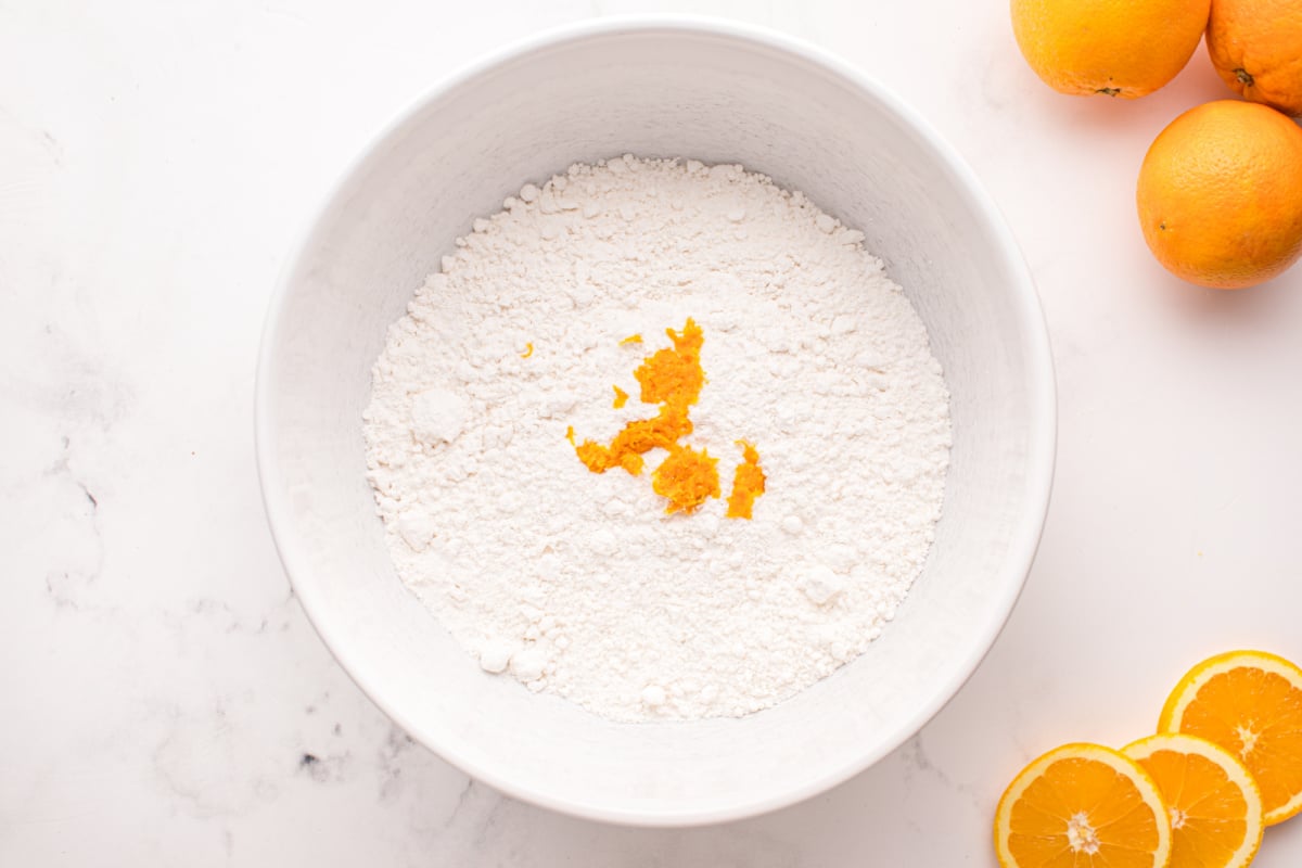 cake mix and orange zest in a bowl