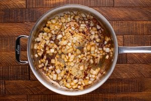 oil and onions cooking in pan