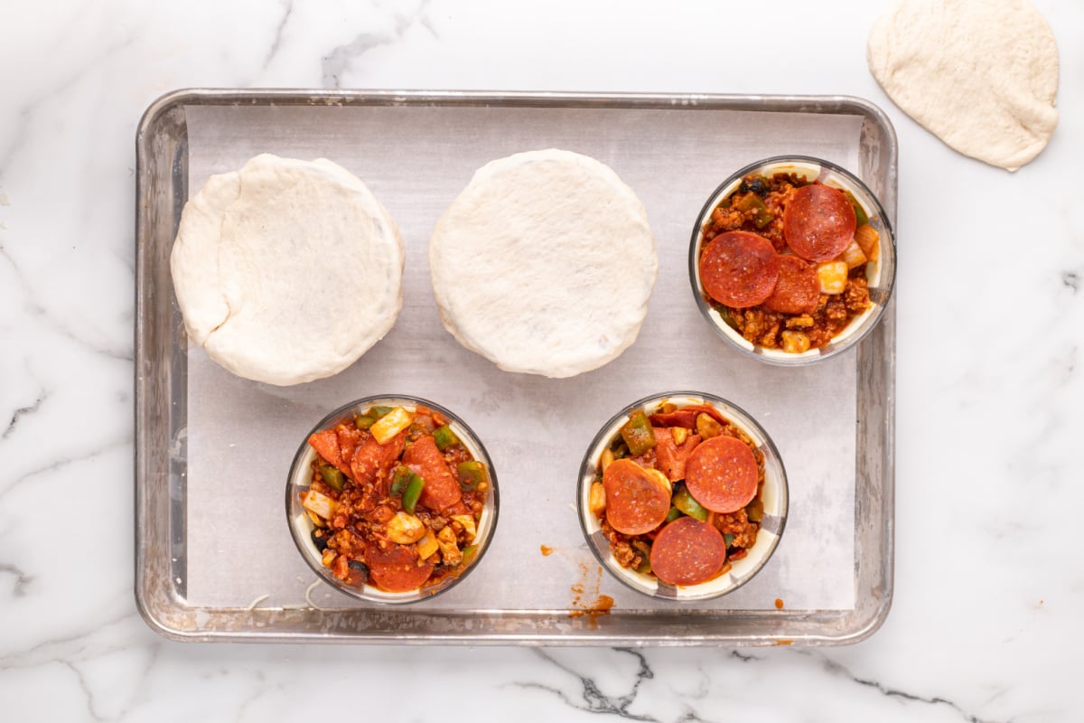 pie crust placed on top of dishes