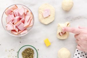 pinching dough sides together