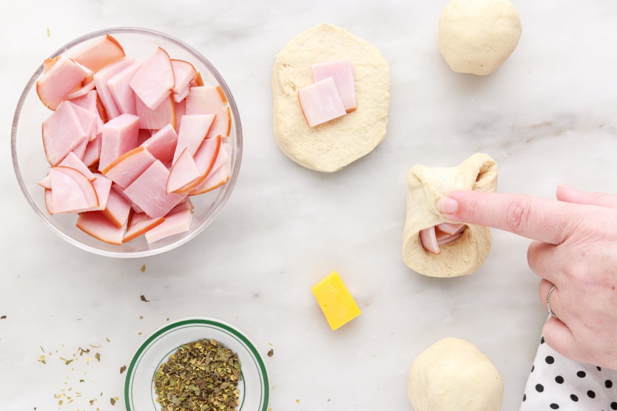 pinching dough sides together