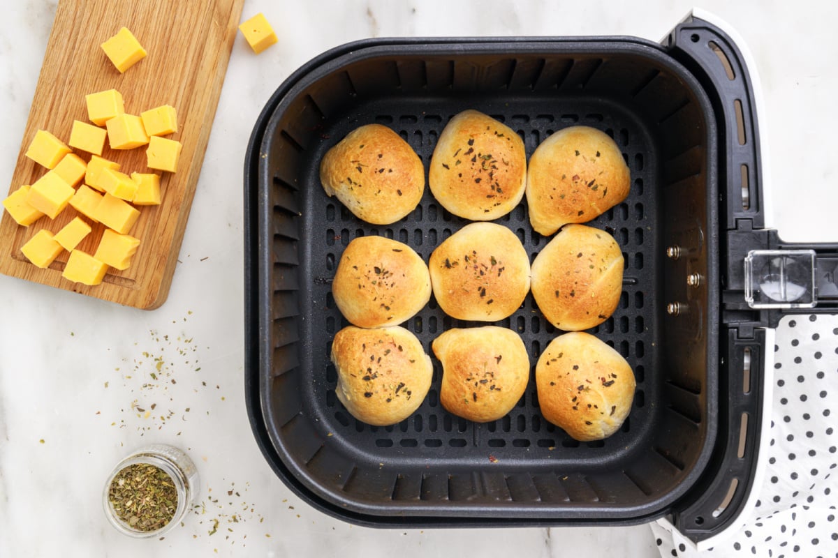 cooked Air Fryer Ham and Cheese Biscuit Bombs in air fryer