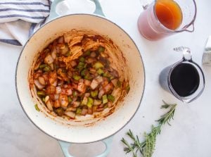 tomato paste added to pot with vegetables