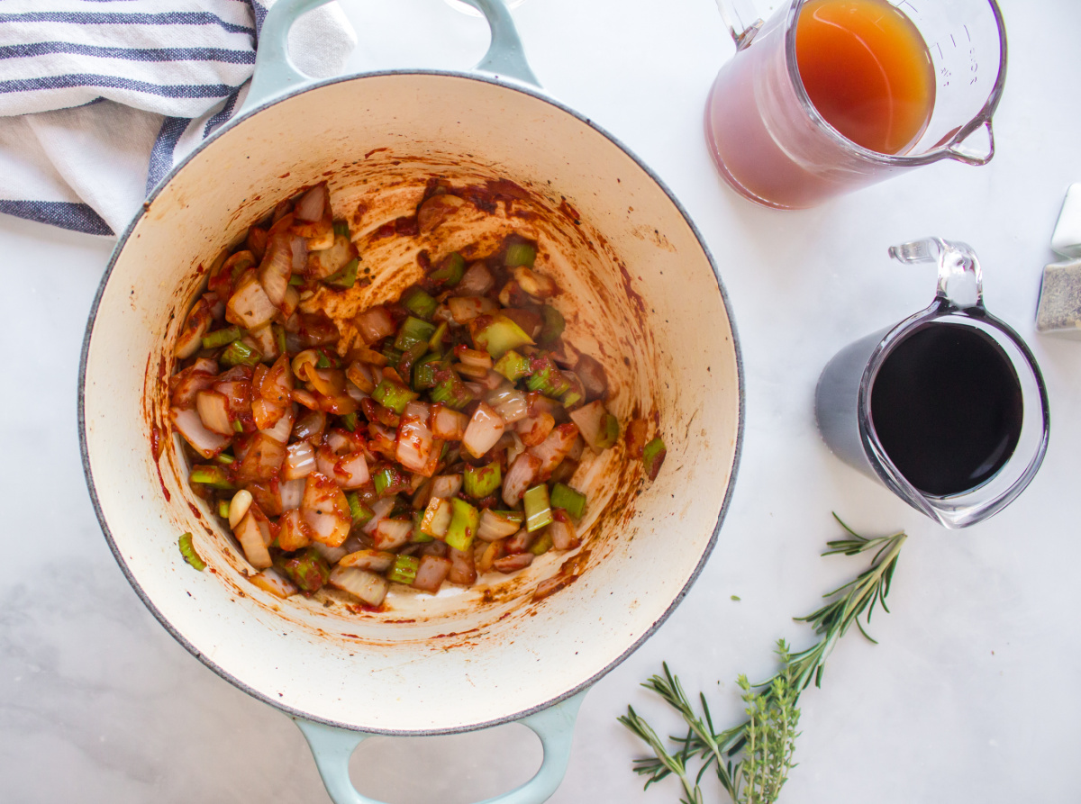 tomato paste added to pot with vegetables