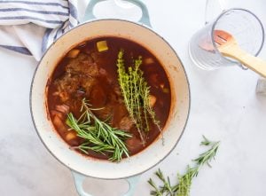 beef broth, thyme sprigs, rosemary sprigs, worcestershire sauce,bay leaves, and your seared roast placed in the pot