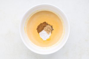 spices and pudding mix added to bowl