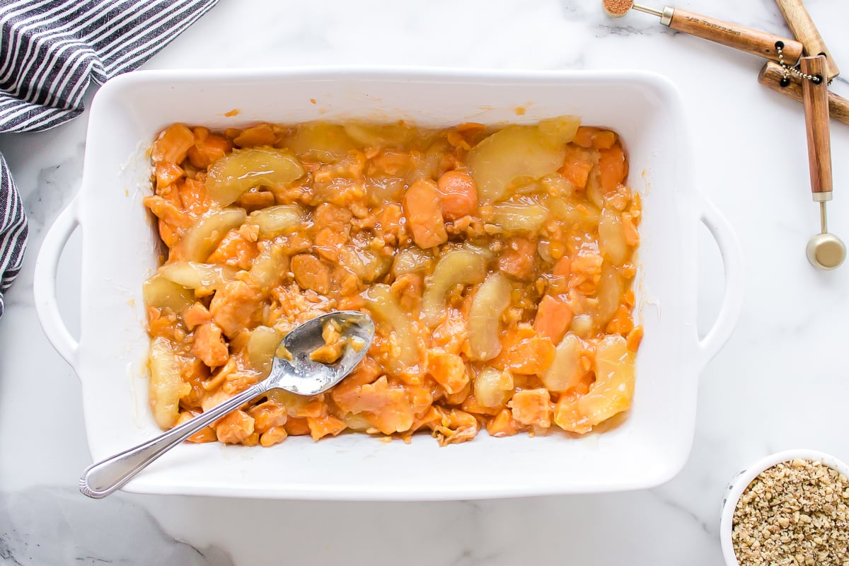 yams and apple pie filling in baking dish