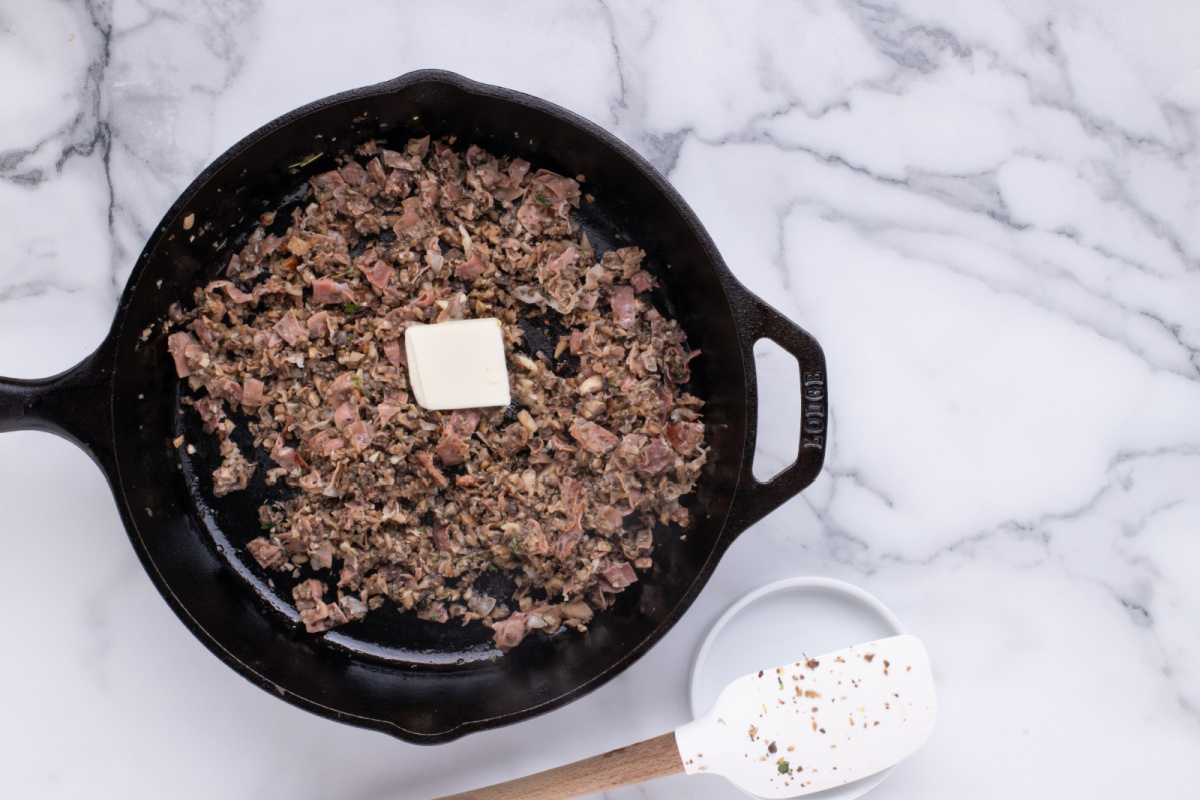 butter added to pan with mushrooms