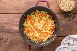 garlic added to soup pot