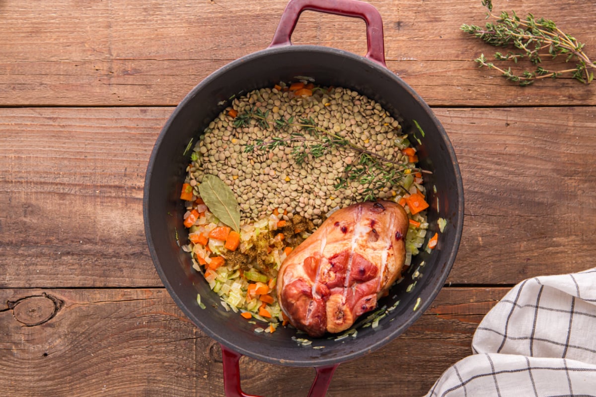 lentils, cumin, thyme, bay leaf, and ham hock added to pot