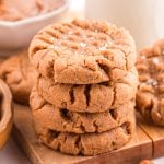 Almond Butter Cookies stacked on a cutting board