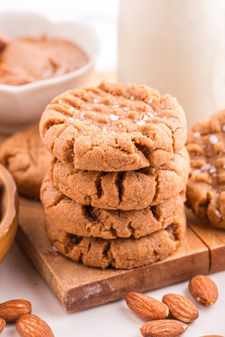 Almond Butter Cookies stacked on a cutting board