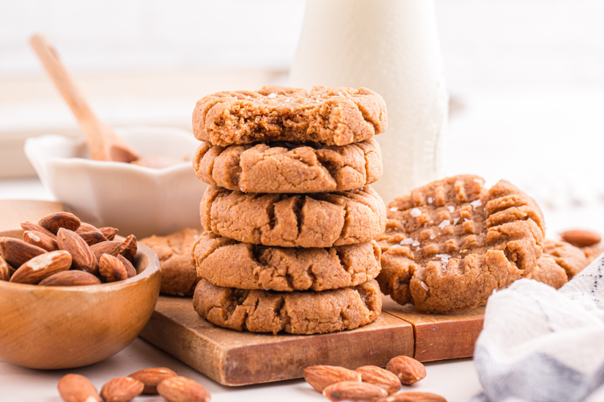 Almond Butter Cookies stacked on a cutting board