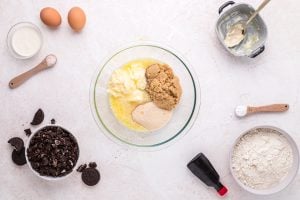 butter, brown sugar, and cane sugar in a bowl