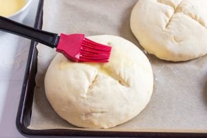 brushing dough with egg wash