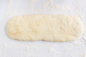 dough laid out on floured surface