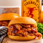 Slow Cooker Fireball BBQ Pulled Chicken sandwich on a plate