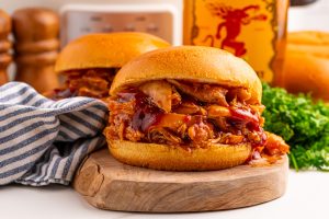 Slow Cooker Fireball BBQ Pulled Chicken sandwiches on a plate