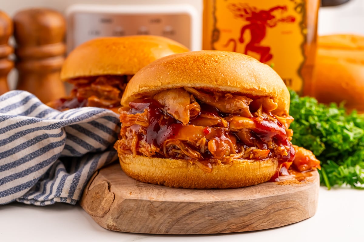 Slow Cooker Fireball BBQ Pulled Chicken sandwiches on a plate