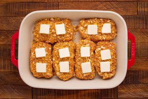 butter tabs placed on top of pork chops
