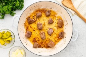 beef bites cooking in pan
