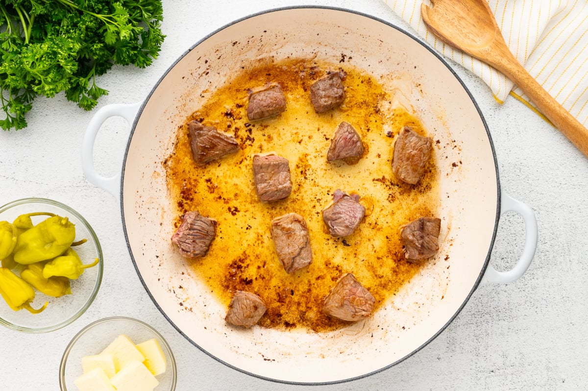 beef bites cooking in pan