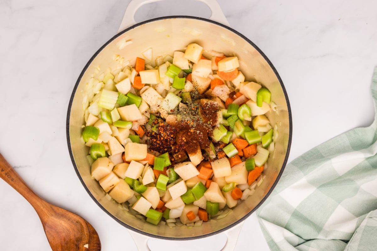 salt, pepper, paprika, and red pepper flakes added to pot