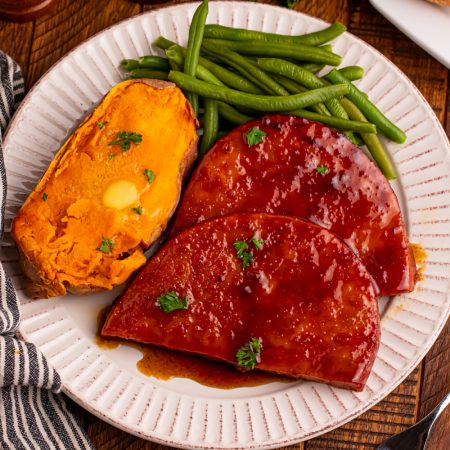 maple glazed ham steaks on a plate