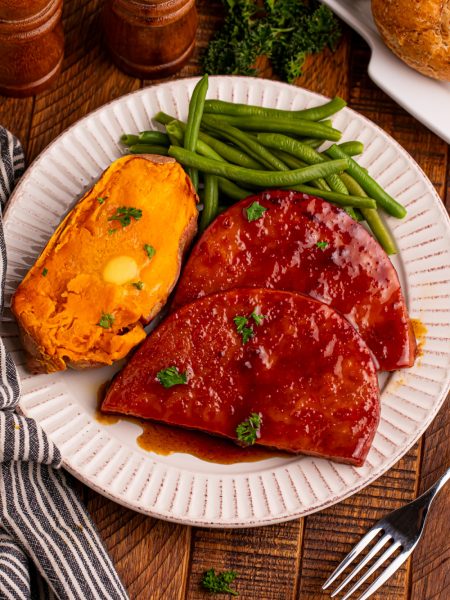 maple glazed ham steaks on a plate