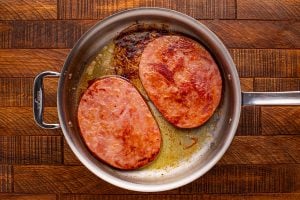 cooking ham steaks in a pan