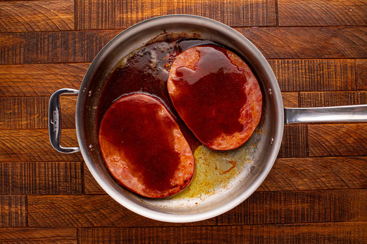 sauce added. to pan with ham steaks